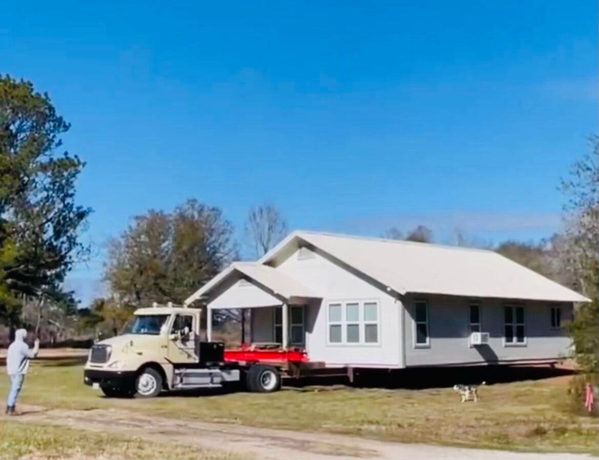 truck is moving a home